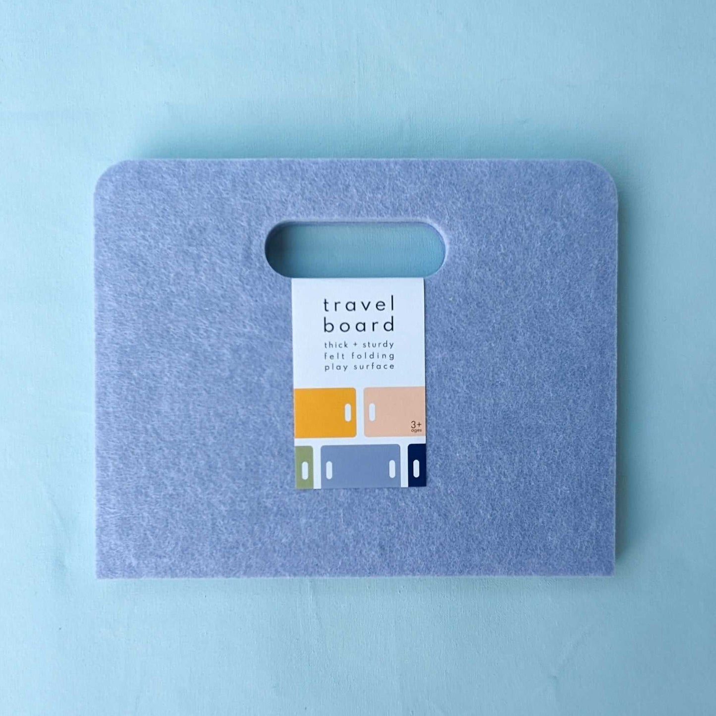 Our closed travel board, is an easy solution for travel-ready play. Designed to support our modern paper dolls, mini tangrams, and interlocking block sets.