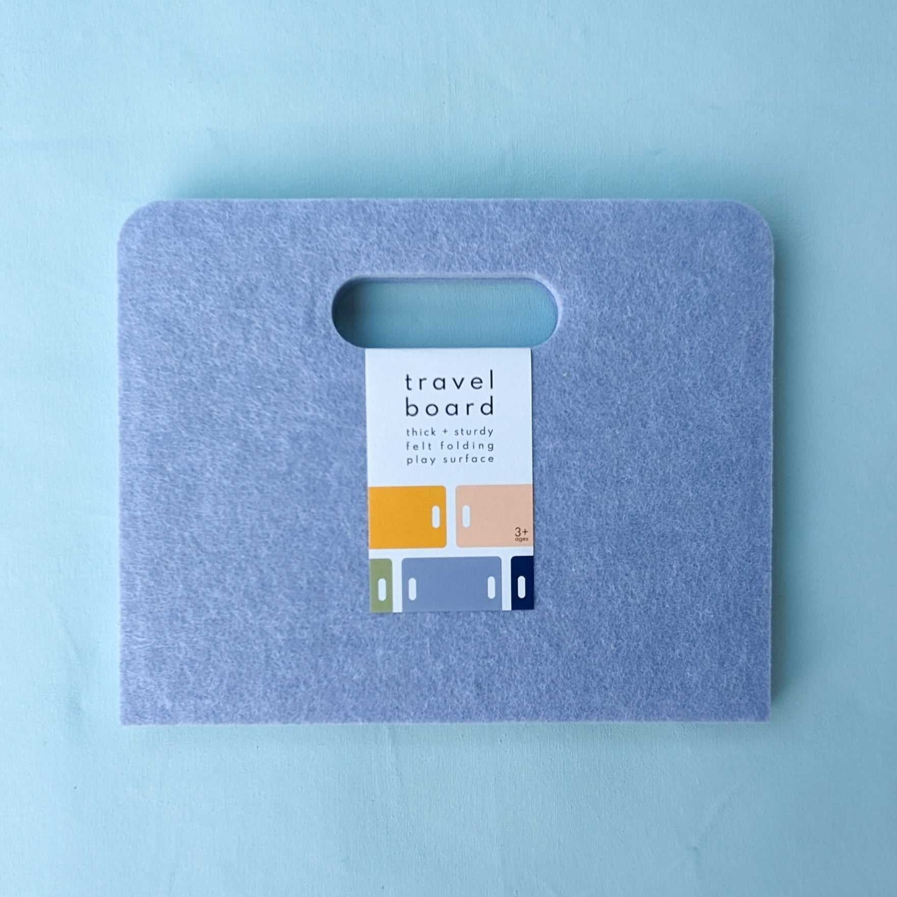 Our closed travel board, is an easy solution for travel-ready play. Designed to support our modern paper dolls, mini tangrams, and interlocking block sets.