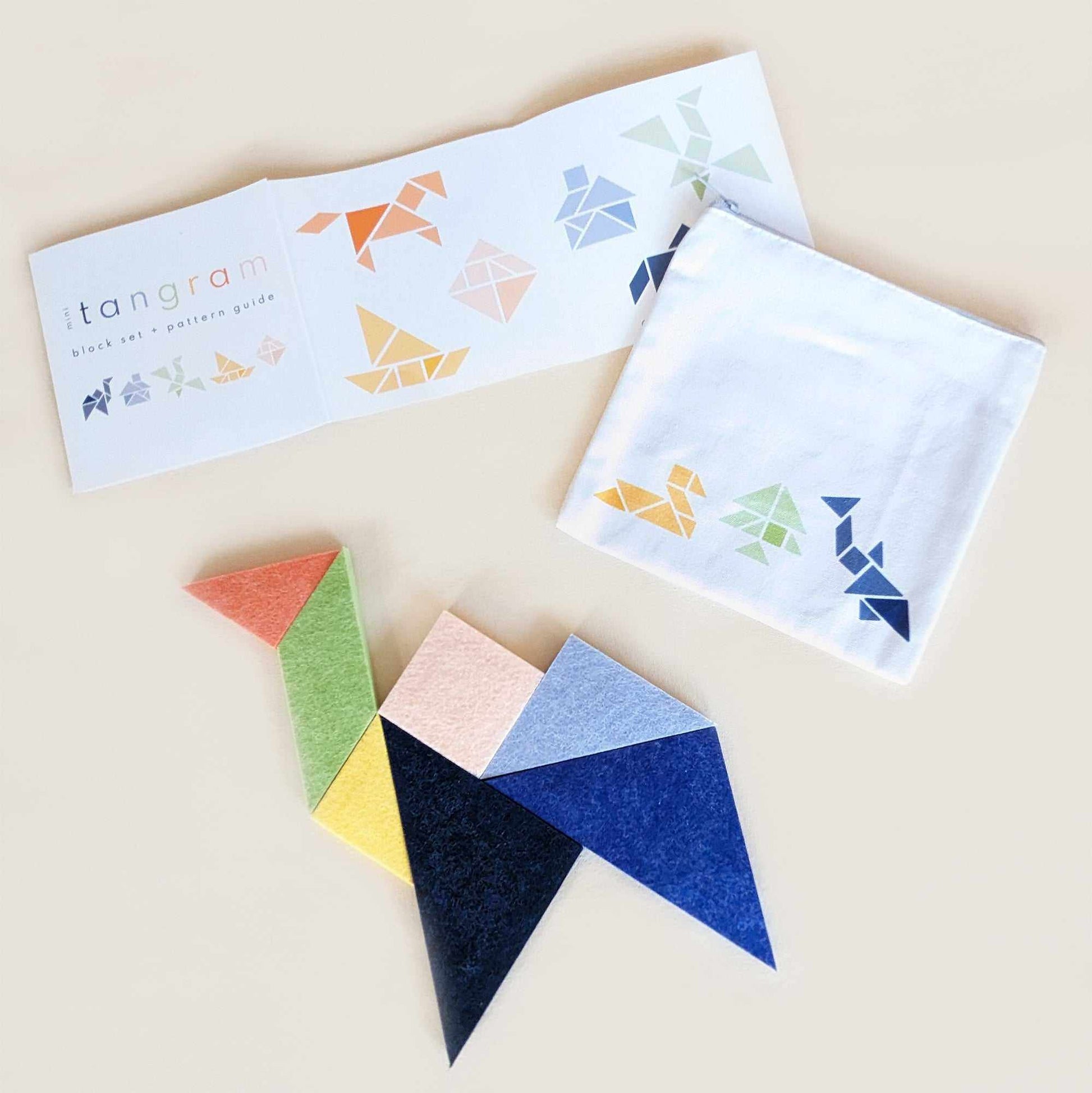 tangram shapes are arranged to make a camel; one of 18 included tangram patterns included in this mini tangram set